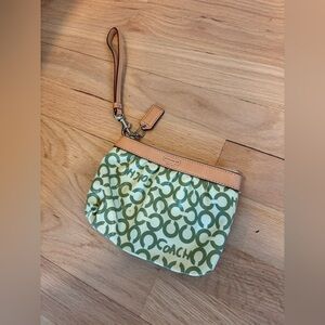 Coach Leah OP ART coated green canvas wristlet with vachetta leather trim